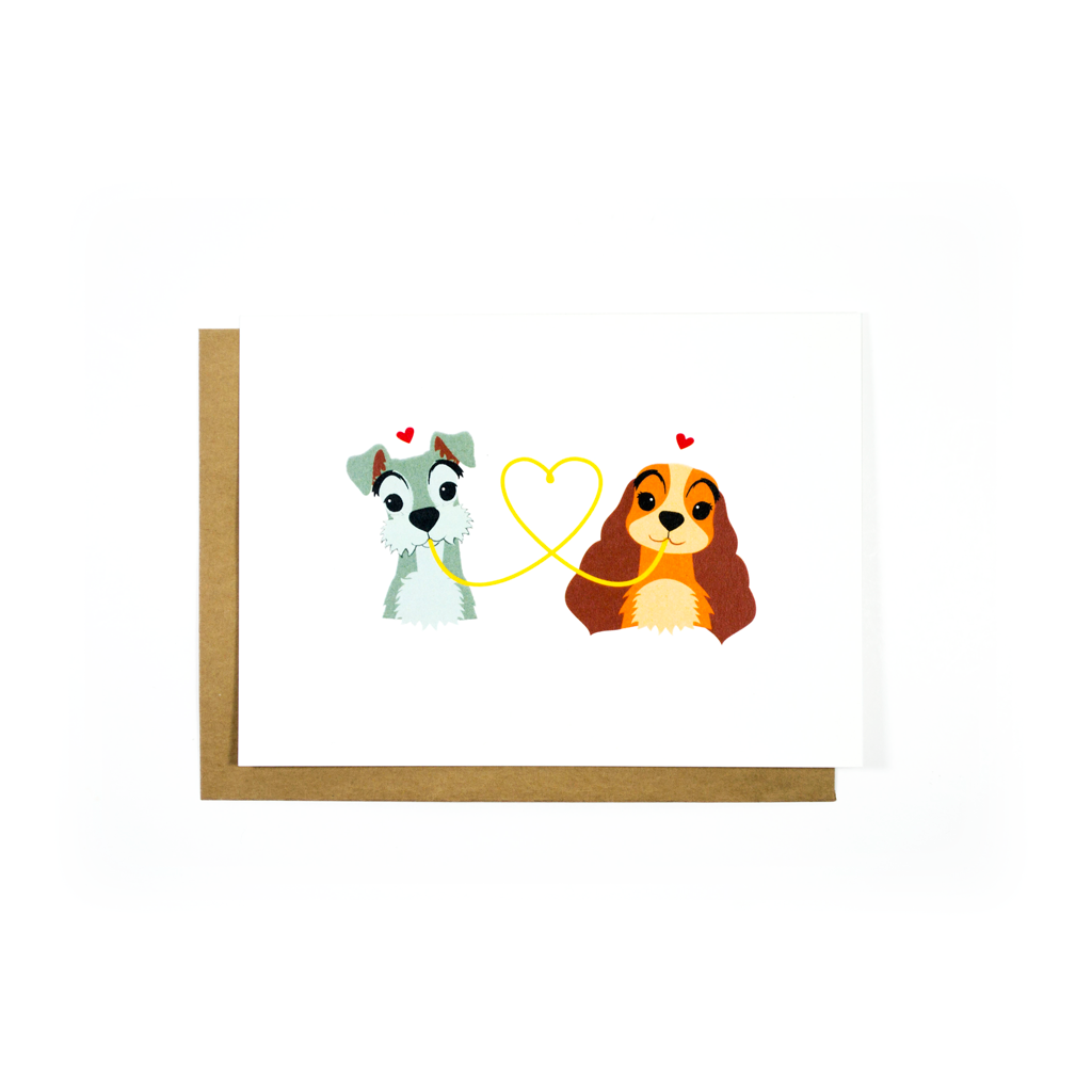 Tarjeta de saludos con ilustración de dos cachorros y corazón